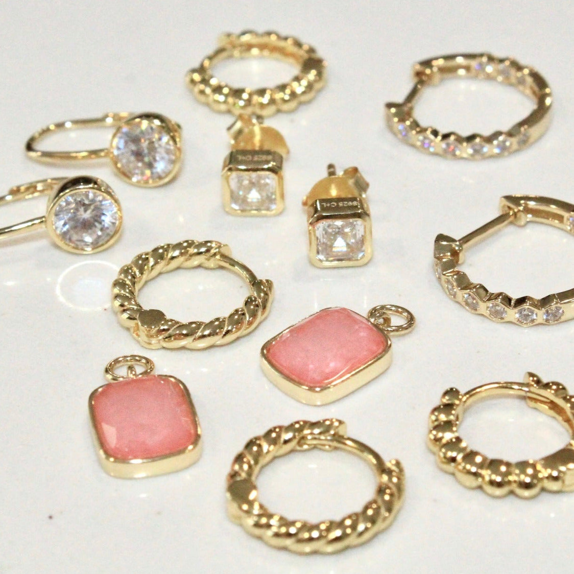 Chloe and Lois Collection of 14k gold plated hoop earrings and stud earrings. Everyday Jewelry