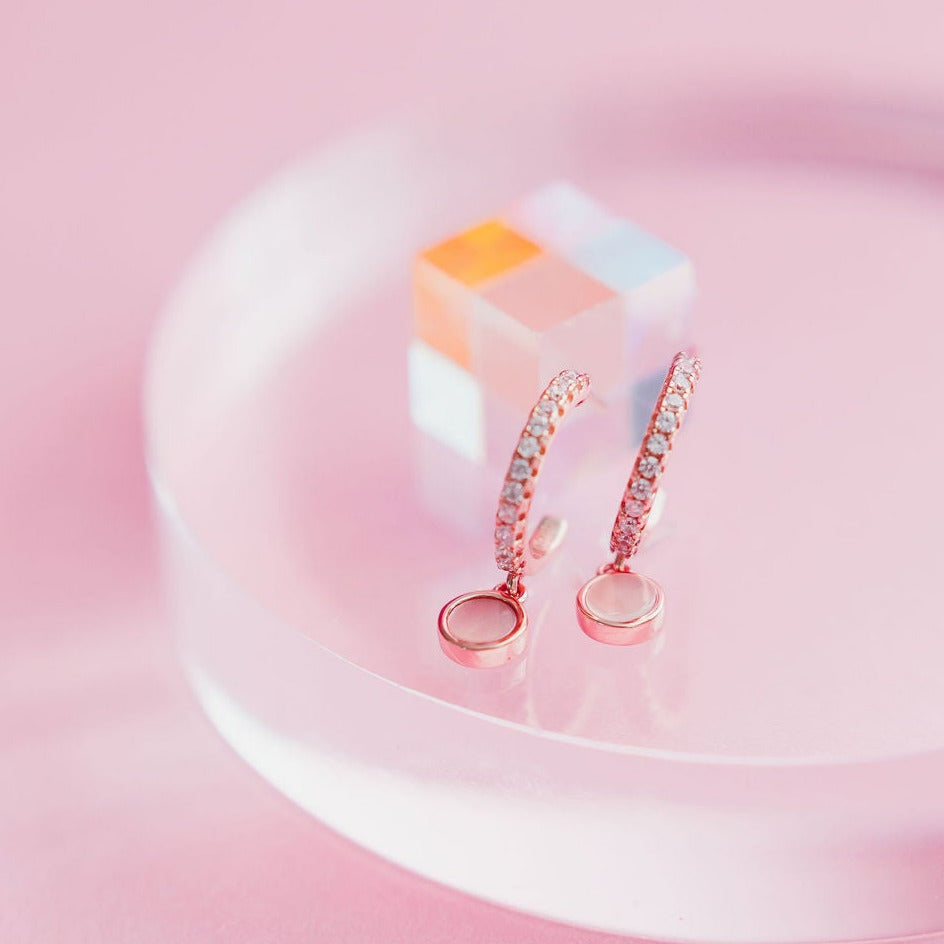 Chloe + Lois Huggie Hoops with Pink Mother of Pearl Dangling Detail